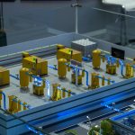 A model of an industrial complex featuring various machinery and pipes, illustrating complex industrial processes.